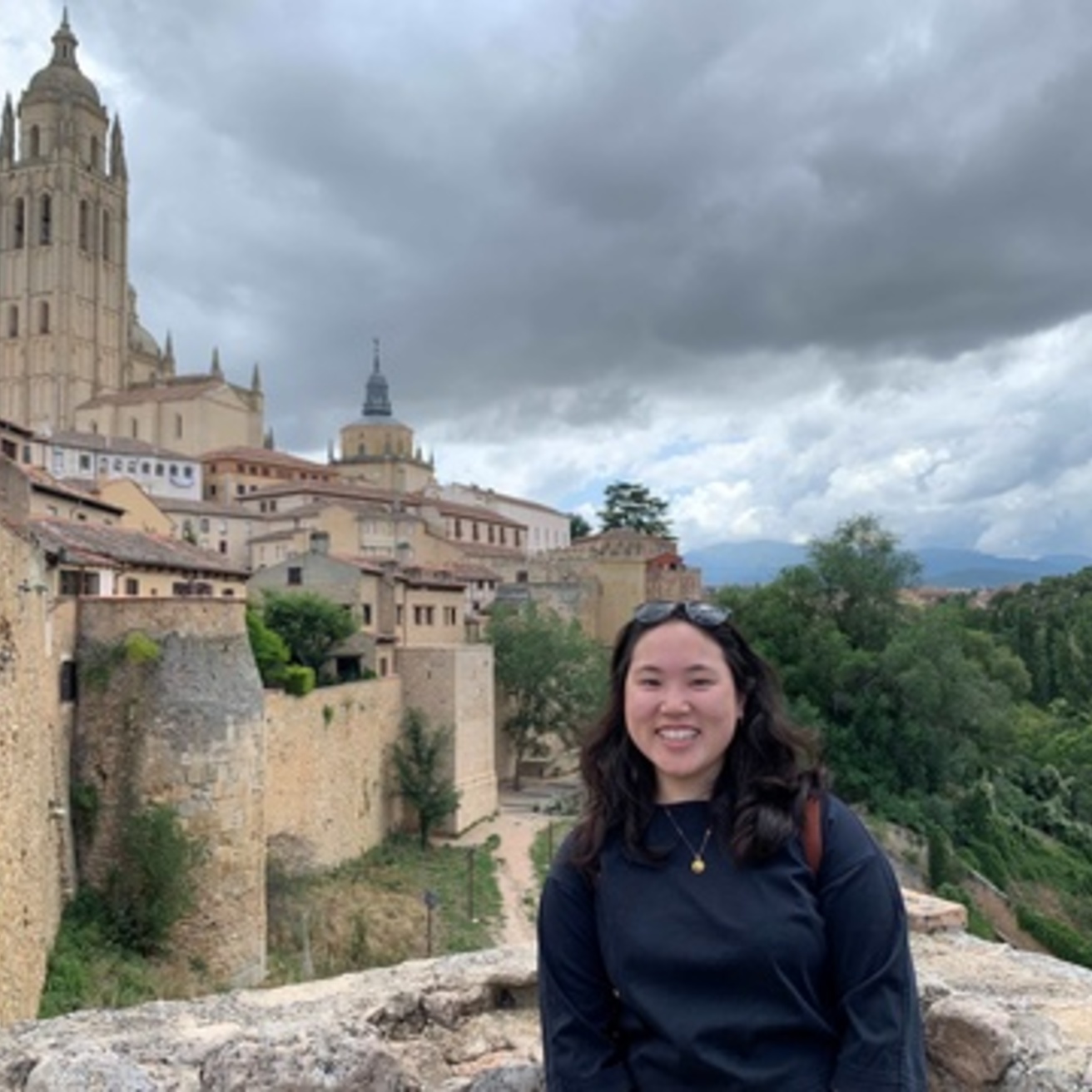 A UIowa student in front of a castle