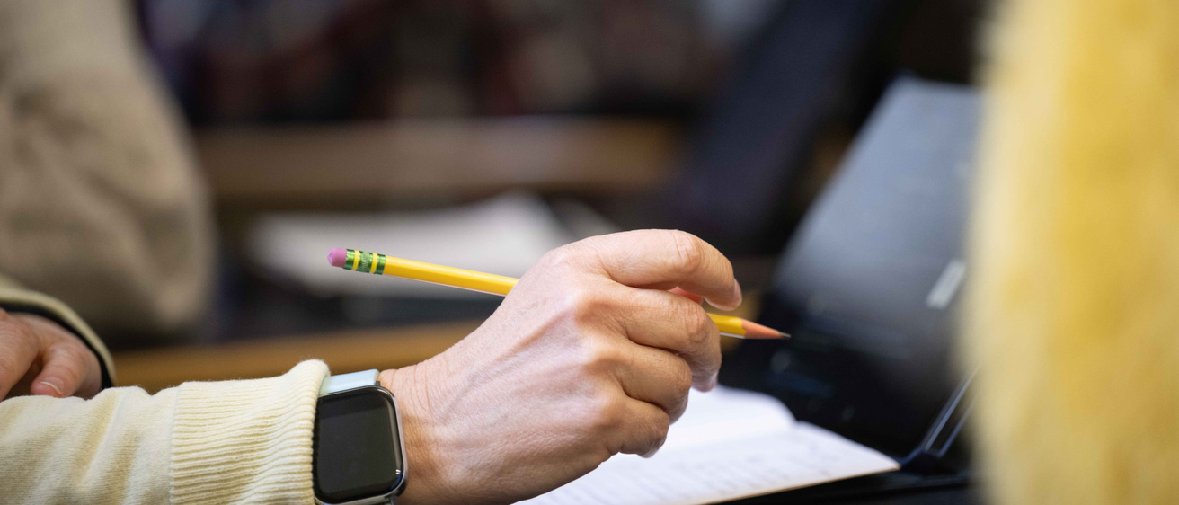 Close-up of a persons hand holding a writing utensil